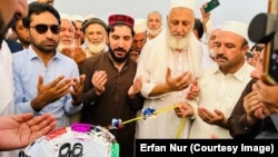 Manzoor Pashteen (center), the leader of the Pashtun Tahafuz Movement, is inaugurated at a jirga , or assembly, on September 29.