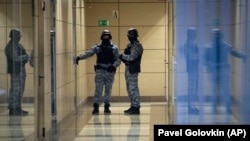 Security officers stand guard at the Aleksei Navalny foundation's office in Moscow on November 5.