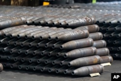 155 mm M795 artillery projectiles are stacked during the manufacturing process at the Scranton Army Ammunition Plant in the United States.