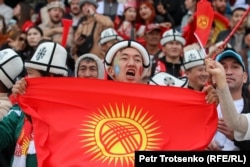 A Kyrgyz fan displays his national pride at a kok-boru match against Uzbekistan on September 9.