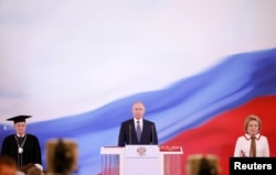 Putin (center) is sworn as Russian president during a ceremony at the Kremlin in Moscow on May 7.