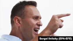 Aleksei Navalny speaks during a rally in support of opposition candidates in the Moscow City Duma elections in downtown of Moscow, July 20, 2019