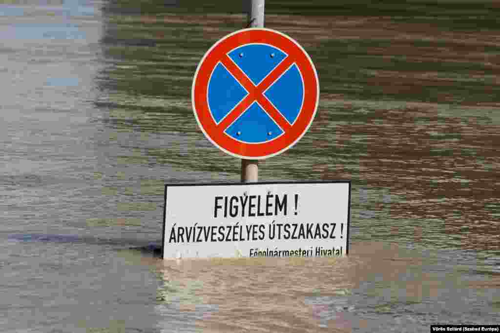 A sign near the Danube River in the Hungarian capital that reads: &quot;Attention! Flood-prone road&quot;