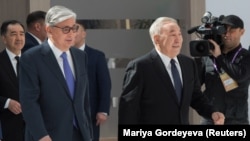 Kazakh President Qasym-Zhomart Toqaev (left) and former President Nursultan Nazarbaev attend the Astana Economic Forum in Nur-Sultan in 2019.