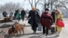 Refugees leave the besieged city of Mariupol on March 22.