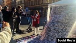 Protesters are seen outside Stockholm District Court during Noury's trial (file photo)