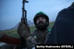 Ukrainian soldier Rustam, 35, watches for enemy FPV drones from the tray of a pickup truck on the outskirts of Novohrodivka, in the Donetsk region on August 31.