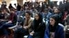 Afghan journalists attend a press conference by former President Hamid Karzai in Kabul in February 2022.