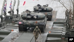 Polish and other NATO troops take part in the Steadfast Defender 24 military exercises in Korzeniewo, Poland, on March 4, 2024.