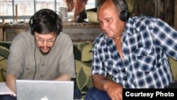 Doctor Gregory Anderson (left) works with Middle Chulym-speaker Vasiliy Gabov (courtesy of The Living Tongues Institute For Endangered Languages)