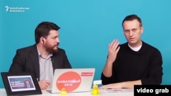 Aleksei Navalny (right) has a YouTube channel that currently has more than 1.6 million subscribers. (file photo)