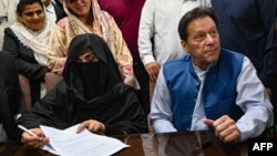 Former Pakistani Prime Minister Imran Khan and his wife, Bushra Bibi (file photo)