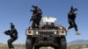 Afghan soldiers patrol outside their military base on the outskirts of Kabul on May 9.