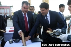 Khurshed Mirzo, vice president of the Football Federation of Tajikistan (right) at an official event with with Rahmon