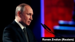 Russian President Vladimir Putin speaks at the World Holocaust Forum in Jerusalem on January 23.