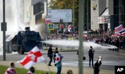 Police use a water cannon against anti-government protesters during a rally in Minsk in October 2020.