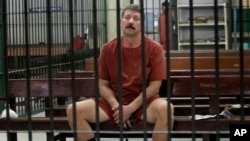 Russian arms dealer Viktor Bout sits in a Thai court's detention room in Bangkok in 2009. He was extradited to the United States the following year. 