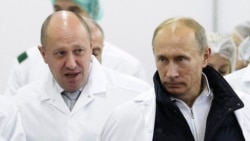 Businessman Yevgeny Prigozhin (left ) with Russian President Vladimir Putin (file photo)