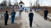 Police officers wearing face masks to protect against the coronavirus guard an entrance to Correctional Colony No. 2 in Pokrov on April 6.