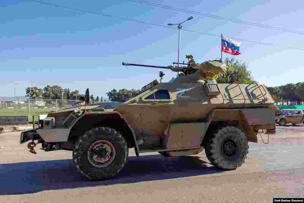 A Russian armored vehicle near the Hmeimim base.&nbsp; Ben Dubow, a senior fellow at the Center for European Policy Analysis, told RFE/RL on December 13 that members of Syria&#39;s de facto government have &quot;expressed a willingness to engage with Russia and have spoken favorably of Russia in comparison to Iran,&quot; but he adds that &quot;this is a newer development in line with their attempts to project moderation and international legitimacy.&quot;