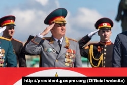 Transdniestrian separatist leader Vadim Krasnoselski (center) attends a May 9 Victory Day military parade in Tiraspol in 2021.