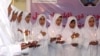 A group of Afghan girls who were trained as midwives take the oath of their profession in 2009.