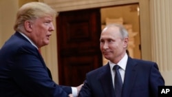 U.S. President Donald Trump (left) speaks with Russian President Vladimir Putin after a summit in Finland in 2018. 