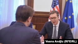 Serbian president Aleksandar Vucic (right) meets with U.S. envoy David Hale in Belgrade on March 8.