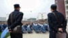 Guards monitor Uyghur inmates at a reeducation camp in northwestern China's Xinjiang region. (file photo)