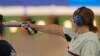 Nino Salukvadze competes in the 10-meter women's air pistol event at her final Olympic Games in Paris on July 27. 