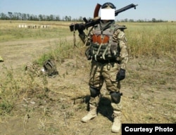 A Belarusian fighter from the Ukrainian volunteer Azov Battalion and member of the Pahonya group, with the call sign "Kim"