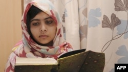 Malala Yousafzai reads a book at the Queen Elizabeth Hospital in Birmingham, where she received treatment after being shot by Taliban militants in her native Swat Valley in 2012.