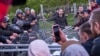 Riot police and protesters facing off in Yekaterinburg on May 14 over plans to build a church in a central park. 