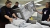 Members of a local electoral commission count ballots during at a polling station in Novosibirsk, Russia, on March 17.