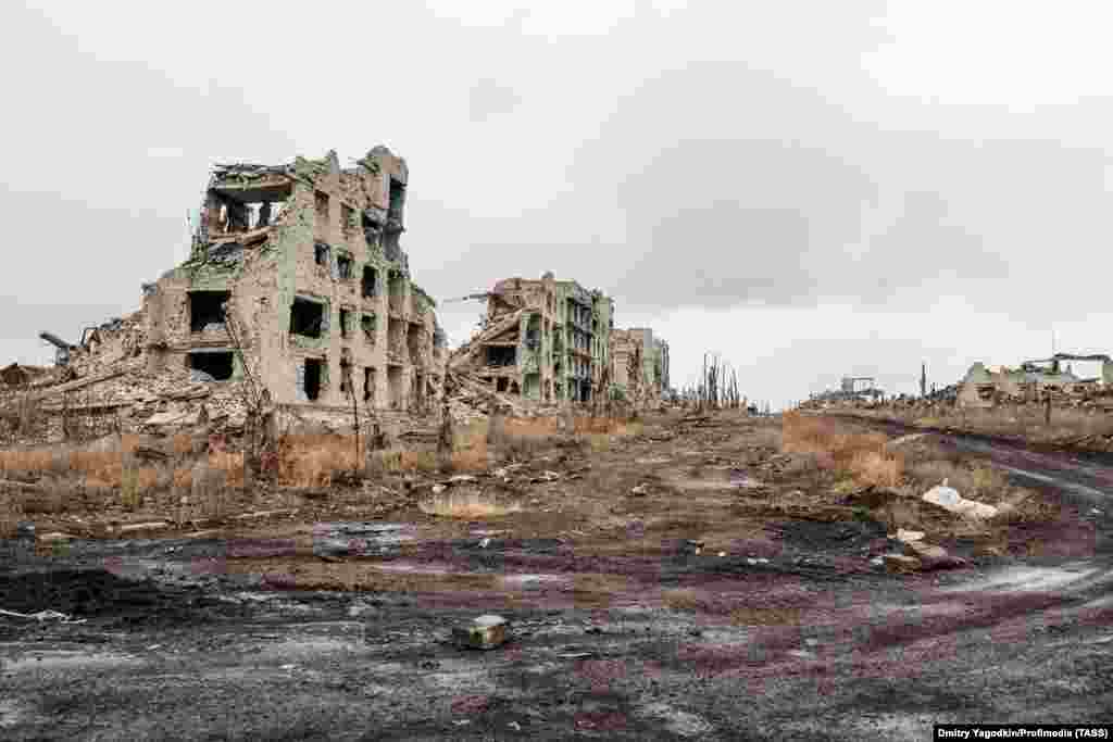 The ruins of buildings in Maryinka photographed on December 4. Ukrainian photographer Alena Grom visited Maryinka several times from 2017 onwards amid what was then a low-level conflict with Russia-backed forces. She told RFE/RL, &quot;the town was small, so everyone knew each other, but locals were out and about only during the day.&quot;&nbsp;