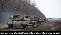 Ukrainian tanks participate in drills at an undisclosed location in the eastern part of the country.