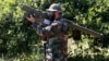  A Lebanese Hizballah fighter holds an Iranian-made antiaircraft missile on the border with Israel.