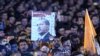 Supporters of the Justice and Development Party (AKP) hold a banner of Turkish President Recep Tayyip Erdogan during a speech by Prime Minister Ahmet Davutoglu at AKP headquarters in Ankara, on November 2.