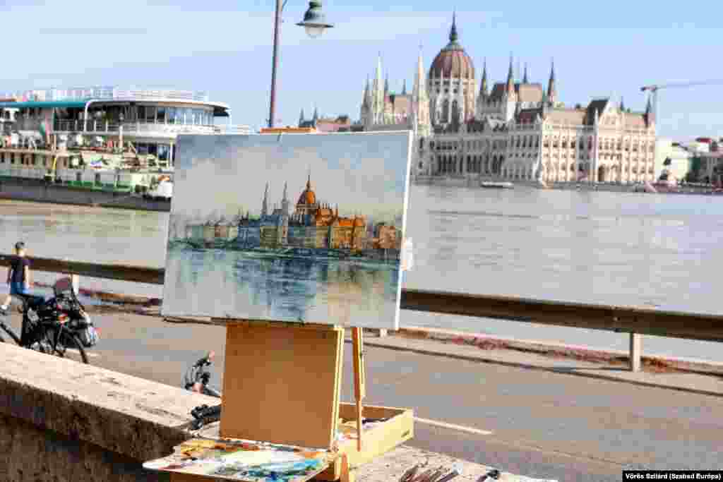 A painting by Ukrainian artist and ex-soldier Peter Kozlovskiy shows the flooded Danube River at the Hungarian parliament in Budapest. &nbsp;