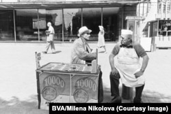 A national lottery salesman (left) chats with an ice-cream vendor in Sofia in 1975.