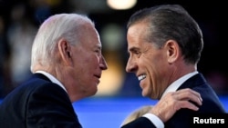 U.S. President Joe Biden (left) greets his son Hunter at the Democratic National Convention in Chicago, Illinois, in August.