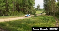 A digitally stitched panorama photo showing the fenced island of Russian territory just a few meters wide.