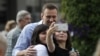 Two women take a photo with Russian opposition politician Aleksei Navalny after he voted in the Moscow City Duma elections.