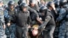 Riot police detain a protester during an opposition rally in Moscow. (file photo)