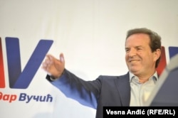 Bogoljub Karic celebrates Aleksandar Vucic's victory in the presidential election at his campaign headquarters in Belgrade in April 2017.