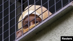 A migrant looks out the window at the Bela-Jezova detention facility north of Prague in November 2015.