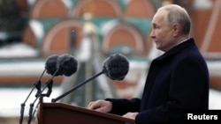 Russian President Vladimir Putin delivers a speech during a military parade on Victory Day in Moscow's Red Square on May 9.