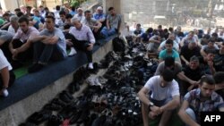 Muslims attend Friday Prayers at Pristina's Grand Mosque in June.