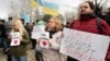 Demonstrators hold banners reading "Lviv speaks Russian language today!" at a rally near the parliament building in Simferopol, Crimea, on February 26.