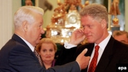 Yeltsin and Bill Clinton hold what appears to be an animated discussion at the Kremlin in 1998 while U.S. Secretary of State Madeleine Albright looks on.